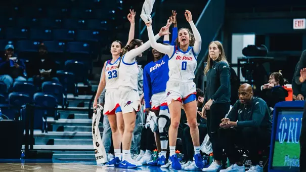 The bench celebrates after a three.
