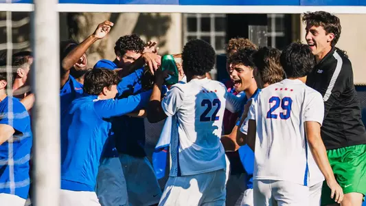 Blue Demons celebrate a Mason Kutch goal.