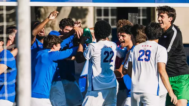 Blue Demons celebrate a Mason Kutch goal.