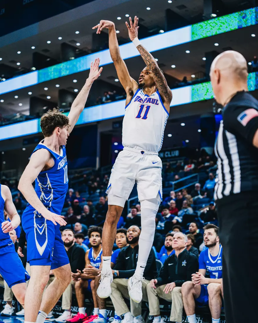 Guard CJ Gunn rises up for a three to beat the halftime buzzer.