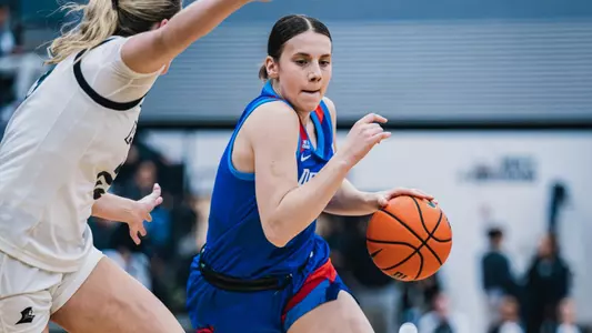 Kate Novik dribbles the ball against Providence