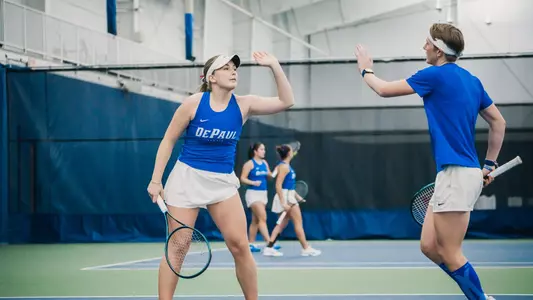 Clara Nilsson and Hannah Smith high five
