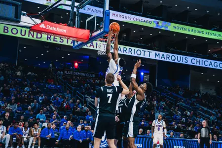 NJ Benson dunks in traffic.