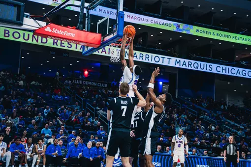 NJ Benson dunks in traffic.