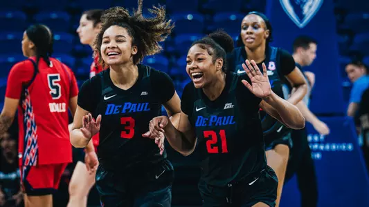 Alayna West and Natiah Nelson celebrate after a win