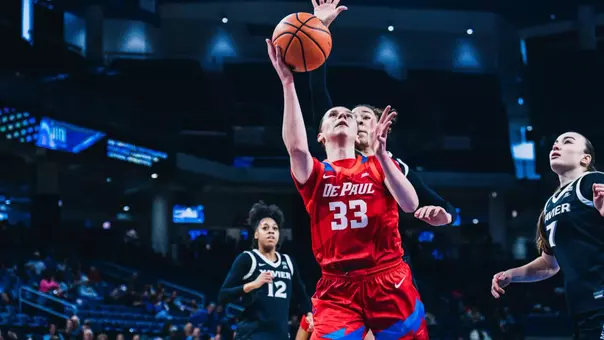 Kate Novik attempts a layup past a defender.