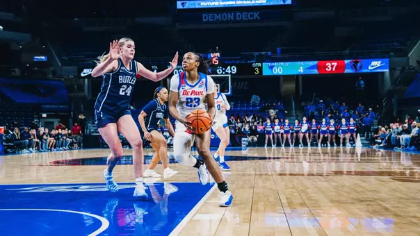 Michelle Ojo driving into the paint