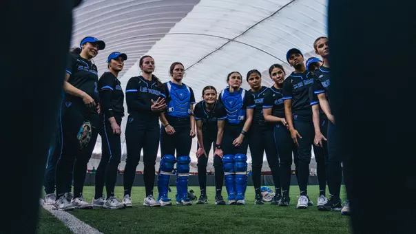 DePaul softball huddle before a game