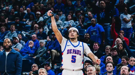 RJ Smith attempts a three pointer.