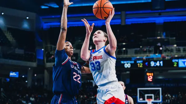 Kate Novik attempts a layup vs. UConn