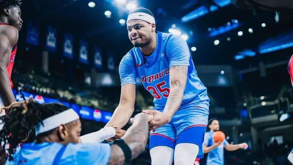 NJ Benson helps up Brandon Maclin.