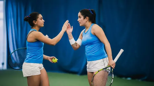 Yasemin Pehlivan and Sasha Stula high-five