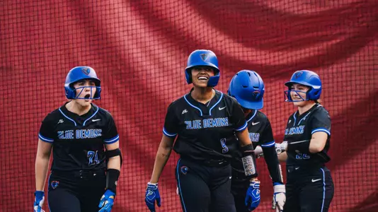 Lydia Ettema and Kali Blount celebrate a HR