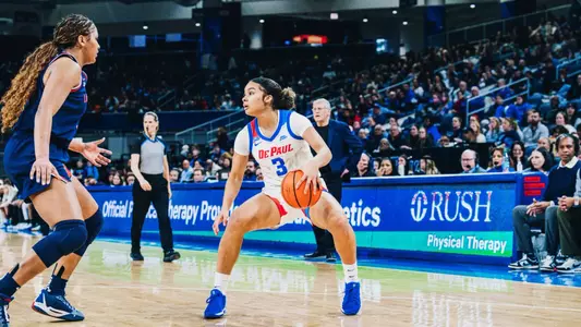 Guard Alayna West crosses over against the UConn defender.