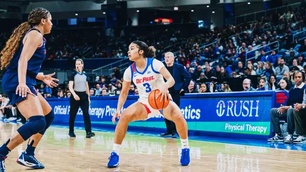 Guard Alayna West crosses over against the UConn defender.
