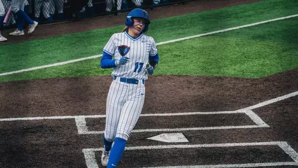Alexis Houge rounds home base after scoring a run.