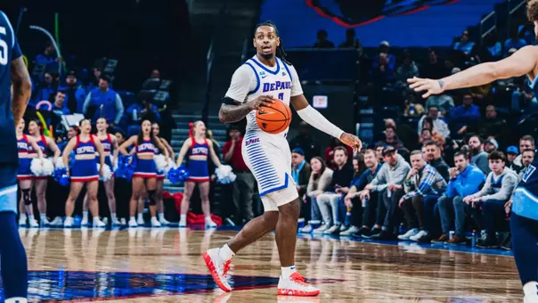 Brandon Maclin takes the ball up the court.