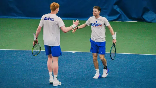 Thomas Giles and Sven Moser high-five