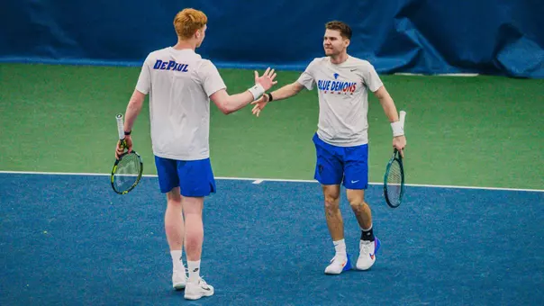 Thomas Giles and Sven Moser high-five