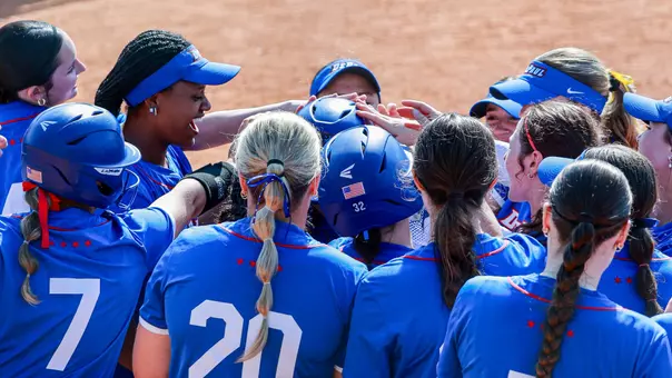 Softball celebrates a home run