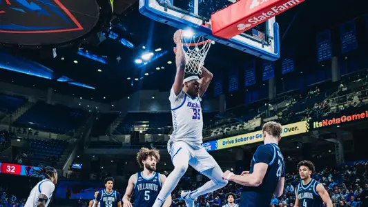 NJ Benson dunks the ball.
