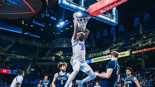 NJ Benson dunks the ball.