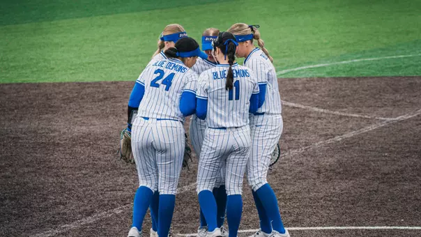 Softball huddles in the circle