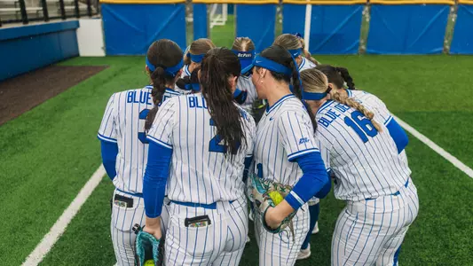 Softball huddles before game