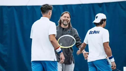 Coach Brothers high-fives Alejandro Gandini