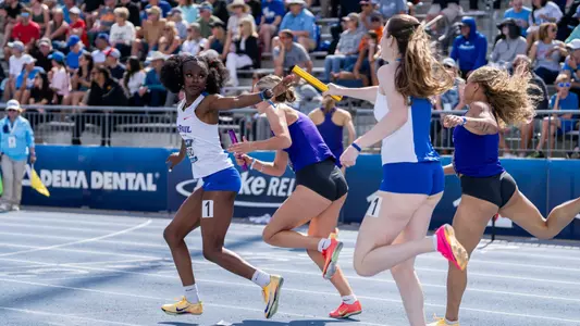 Aisha Kazeem, Claire Dunn exchange baton