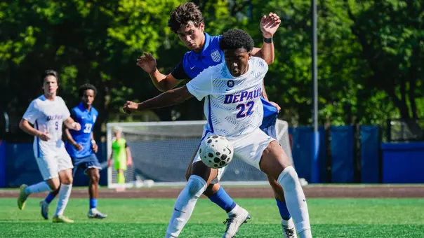 Jordan Clagette fends off defender