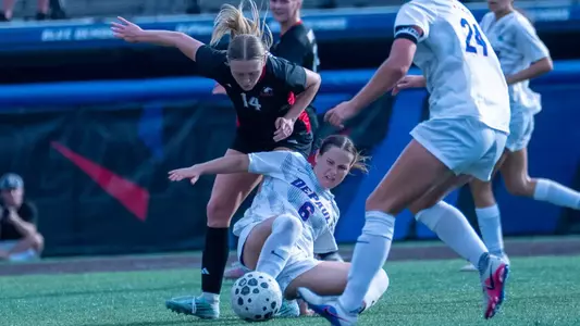 Dory Latenser makes a sliding challenge.