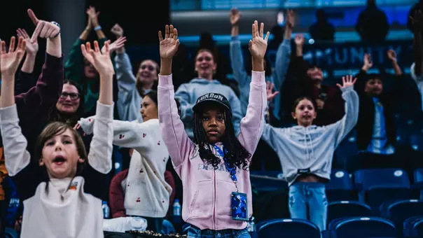 Young fan gets excited for a t shirt at a women's basketball game