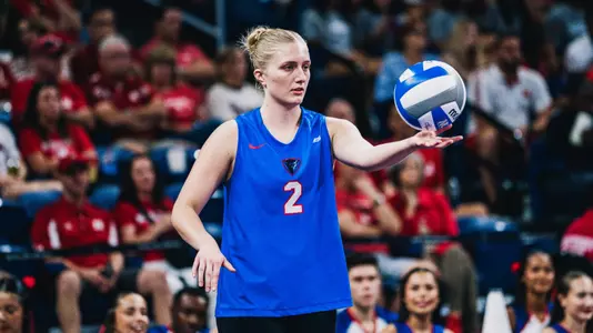 Abby Cahill serves for DePaul