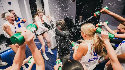 Marie Zidek DePaul volleyball team celebrates win over Marquette with water in locker room