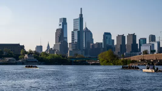 Skyline With Men's Boats