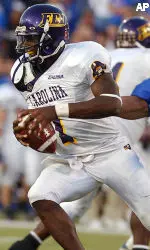 Tulsa's Alain Karatepeyan pressures East Carolina quarterback James Pinkney. (AP Photo/Tulsa World, Stephen Pingry)