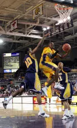 Japhet McNeil converts the reverse lay up against N.C. A&T.