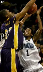 Corey Rouse, left, scored 14 points and pulled down nine rebounds at ODU. (AP Photo/The Virginian-Pilot, Stephen M. Katz)