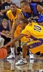 East Carolina's Japhet McNeil (10) battles Memphis's Darius Washington (35) during the second half of their college basketball game, Wednesday, Jan 11, 2006 in Greenville, NC. Memphis held on to win 77-67. (AP Photo/ Karl DeBlaker)