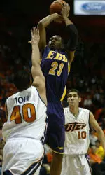 East Carolina's Corey Rouse (23) puts up a shot over Texas-El Paso's John Tofi (40) as UTEP's Miguel Ayala (10) looks on during the first half. (AP Photo/El Paso Times, Victor Calzada)