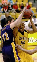 East Carolina forward Taylor Gagnon (12) stops Southern Mississippi forward Jason Forte (00) from shooting during the first half of a college basketball game Saturday, March 4, 2006, in Hattiesburg, Miss. (AP Photo/Steve Coleman)