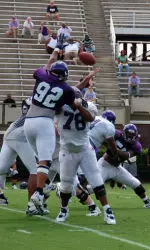 DE Marcus Hands (92) battles OT Eric Graham (78) during ECU's second scrimmage of the season
