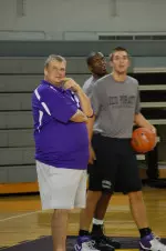 Coach Mack McCarthy watches as the Pirates go through preseason drills.