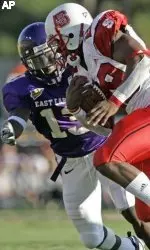 East Carolina's Travis Simmons, left, moves in to tackle North Carolina State's Jamelle Eugene during the first half. (AP Photo/Gerry Broome)