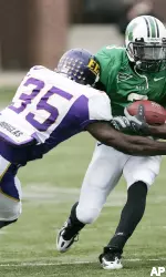 Jerek Hewett stops Marshall wide receiver E.J. Wynn . (AP Photo/Randy Snyder)