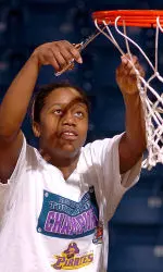 Tournament MVP LaCoya Terry cuts down the net following ECU's 79-70 win over Rice in the C-USA Championship game