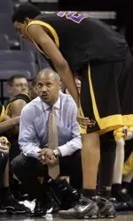 East Carolina head coach Ricky Stokes talks with forward John Fields as they play Tulsa in the first half. (AP)