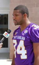 LB Pierre Bell conducts an interview with WITN-TV during Saturday's media day event on the ECU campus.