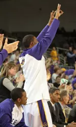 Chris Turner celebrates a 3-point basket from the bench.